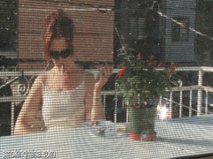 TargetVids presents: Cute chick smokes on the porch as he films it